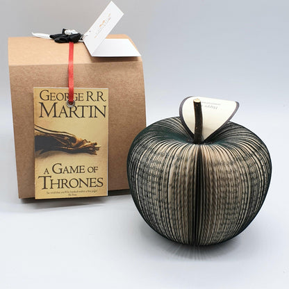 Close-up of Game of Thrones book apple showing hand-cut book pages detail
