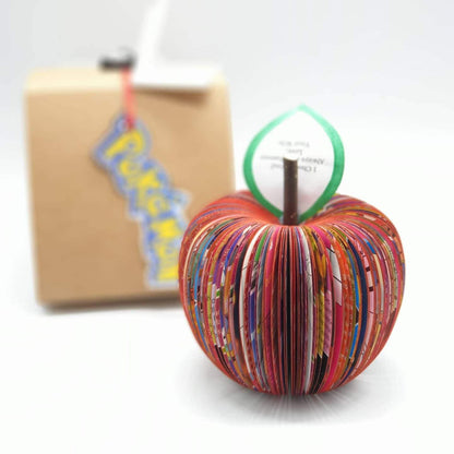 Pokémon book apple held in hands to show size, handmade paper anniversary gift