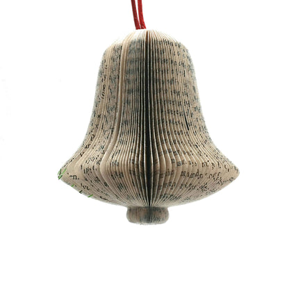 Hanging bell book decoration held in hands to show size