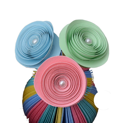Close-up of Mini Pastel Rainbow Vase and Flowers vase showing hand-cut book page detail