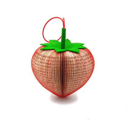 Close-up of strawberry book gift showing handmade 3D book page element