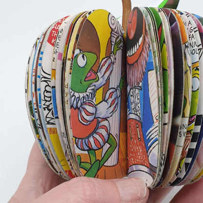 Close-up of Muppet Apple showing hand-cut book pages, handmade teacher gift