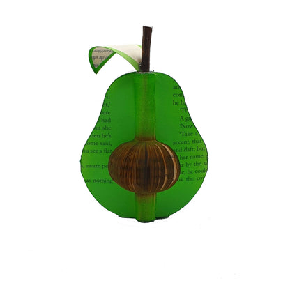 Handmade book avocado held in hands to show size