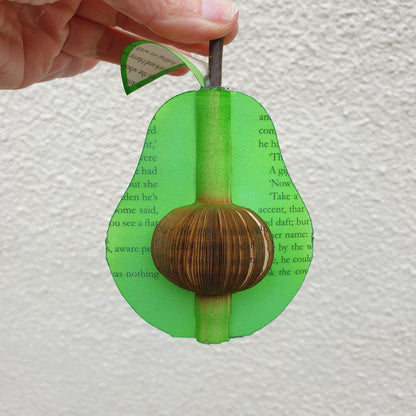 Handmade book avocado displayed beside original book