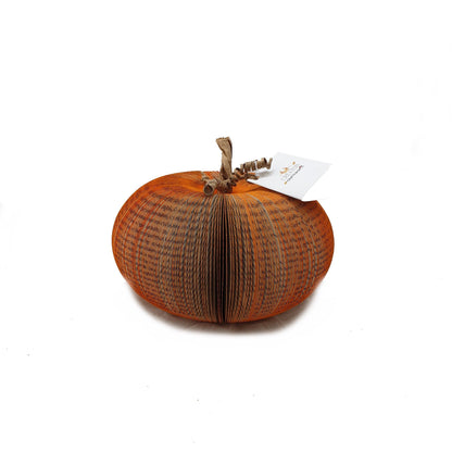 Medium book page pumpkin displayed as autumn decoration