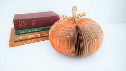 Close-up of medium book page pumpkin showing hand-cut book pages