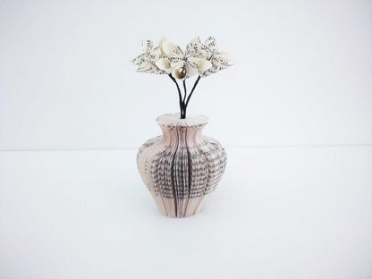 Close-up of Mini Urn Vase and Flowers vase showing hand-cut book page detail