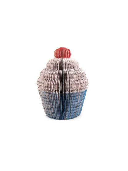 Handmade book cupcake held in hands to show size